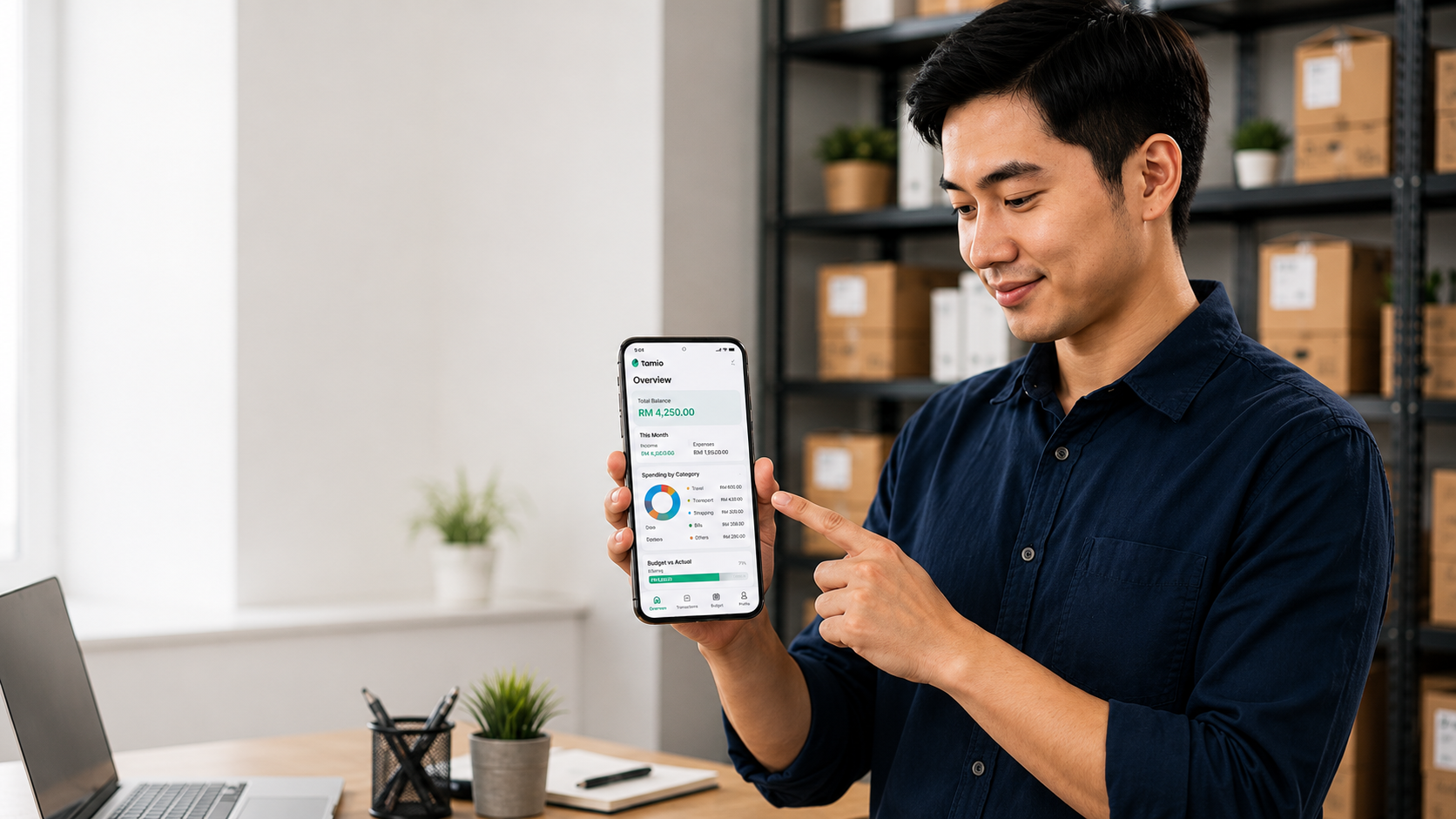 A business owner presenting the Tamio budgeting app on a phone